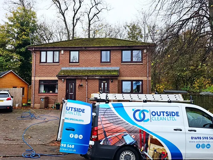 Outside Clean attending a property in Glasgow to clean a roof